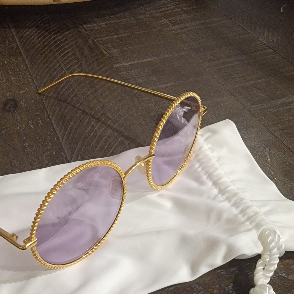 Boucheron Oval golden sunglasses